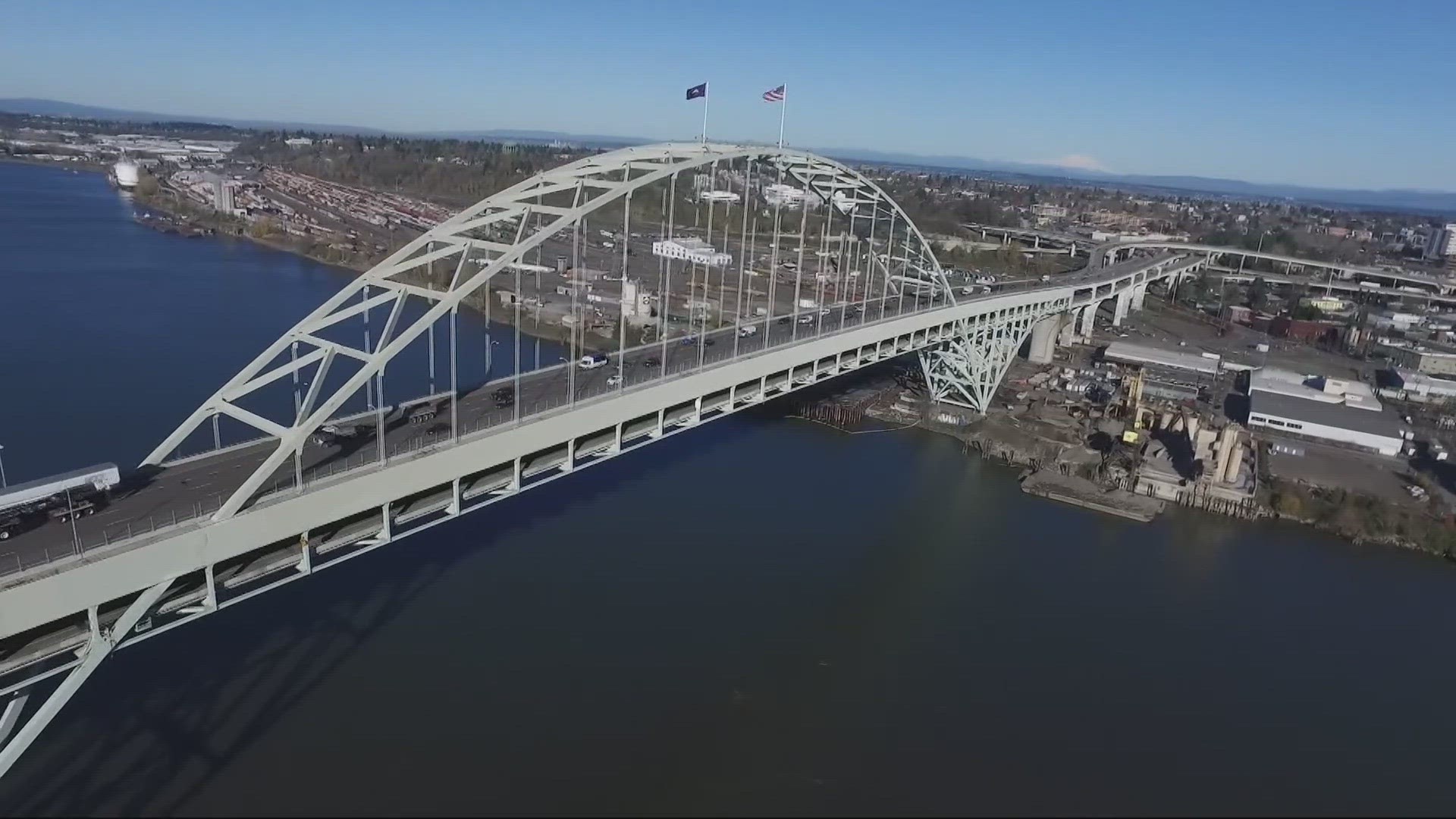 Devon Haskins shares some history about the Fremont Bridge, and how they change the flag poles that stand above it. The bridge first opened on November 15th, 1973.